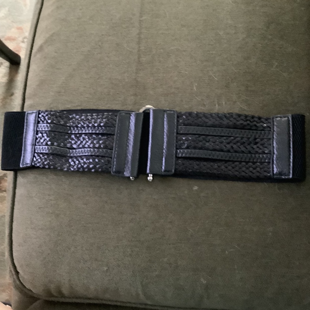 Belt in Black faux leather 3 inch wide stretch belt with front closure.